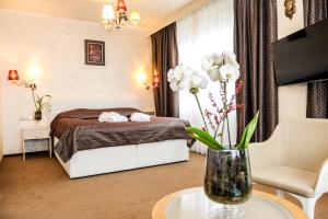 Posteľ alebo postele v izbe v ubytovaní Myo Hotel Mysterius