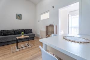 a living room with a couch and a table at Apartments Miki in Bar