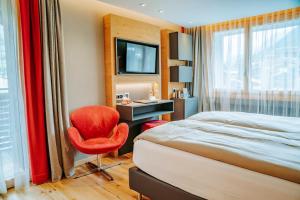 Postel nebo postele na pokoji v ubytování Hotel Eden Wellness