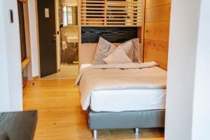 Postel nebo postele na pokoji v ubytování Hotel Eden Wellness
