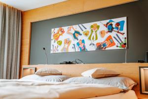 Postel nebo postele na pokoji v ubytování Hotel Eden Wellness