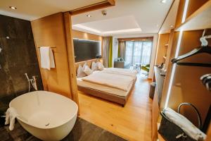 Postel nebo postele na pokoji v ubytování Hotel Eden Wellness
