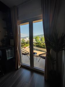 a room with a window with a view of a patio at Diamond Stan na Dan in Kiseljak
