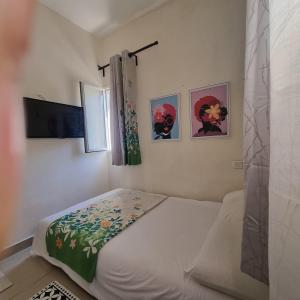 Postel nebo postele na pokoji v ubytování bugrashov 13 room