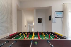 a ping pong table with toy figures on it at Villa Nada with 6 bedrooms in Vodnjan