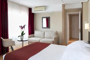 Cama o camas de una habitación en Hotel Santiago Apóstol