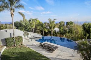 a swimming pool in the backyard of a villa at Winding Way in Malibu