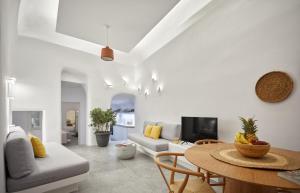 a living room with a table and a couch at 1949 Cave Residence in Pirgos