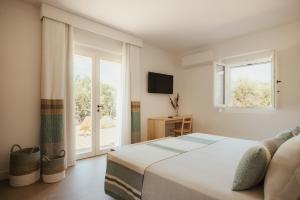 Postel nebo postele na pokoji v ubytování NUALI - Stazzo in Gallura