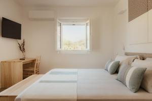 Postel nebo postele na pokoji v ubytování NUALI - Stazzo in Gallura