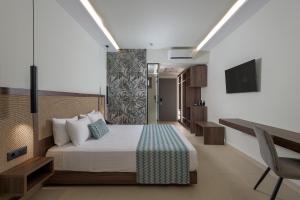Ένα ή περισσότερα κρεβάτια σε δωμάτιο στο Oceanis Park Hotel