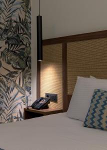 Ένα ή περισσότερα κρεβάτια σε δωμάτιο στο Oceanis Park Hotel