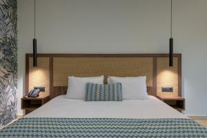 Ένα ή περισσότερα κρεβάτια σε δωμάτιο στο Oceanis Park Hotel