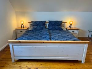 Postel nebo postele na pokoji v ubytování Ferienwohnung Am Langenberg