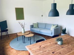 a living room with a couch and a table at Lay-Zeit in Kottenheim