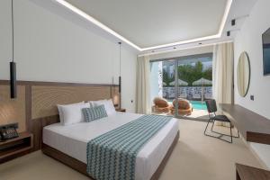 Ένα ή περισσότερα κρεβάτια σε δωμάτιο στο Oceanis Park Hotel