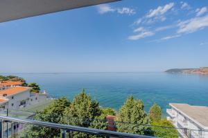a view of the ocean from a balcony at Bliss Apartments in Sutomore