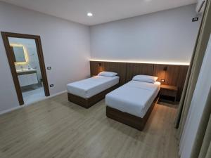 Postel nebo postele na pokoji v ubytování Hotel Aleks