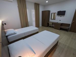 Postel nebo postele na pokoji v ubytování Hotel Aleks