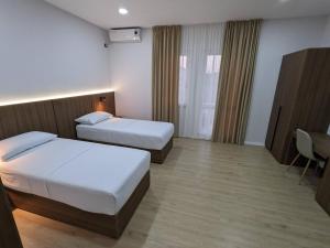 Postel nebo postele na pokoji v ubytování Hotel Aleks