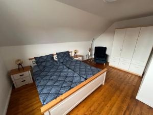 Postel nebo postele na pokoji v ubytování Ferienwohnung Am Langenberg