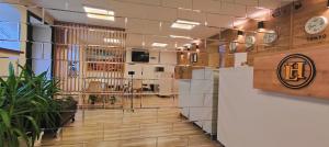 a lobby of a office building with a reception desk at Light Hotel in Tbilisi City