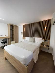 Voodi või voodid majutusasutuse Hotel Plaza Norte Cali toas