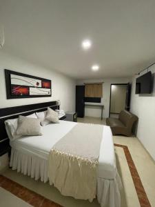 Voodi või voodid majutusasutuse Hotel Plaza Norte Cali toas