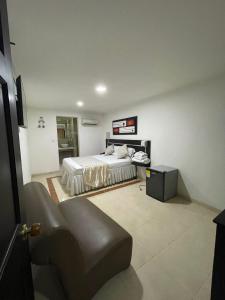 Voodi või voodid majutusasutuse Hotel Plaza Norte Cali toas