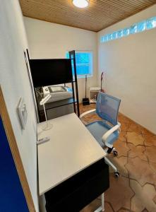 an office with a desk and a chair in a room at Elegant 1BR Montrose - Napoli The Italian Plaza in Houston +4 photos