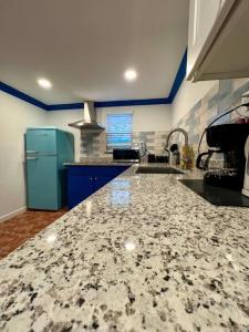 a kitchen with a sink and a counter top at Elegant 1BR Montrose - Napoli The Italian Plaza in Houston