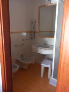 Koupelna v ubytování Alma Hotel San Giorgio + 22 fotografií