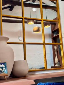a window with a yellow frame in a room at Casa Villa María, Recién Remodelada in Villa de Leyva