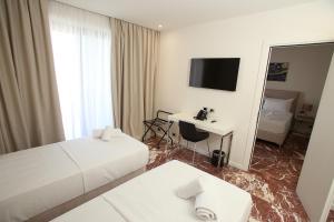 Rúm í herbergi á Durres Bay Hotel