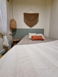 Ένα ή περισσότερα κρεβάτια σε δωμάτιο στο Mascomunal hostel
