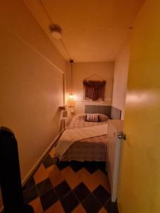 Ένα ή περισσότερα κρεβάτια σε δωμάτιο στο Mascomunal hostel