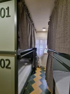 Ένα ή περισσότερα κρεβάτια σε δωμάτιο στο Mascomunal hostel