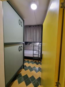 Ένα ή περισσότερα κρεβάτια σε δωμάτιο στο Mascomunal hostel