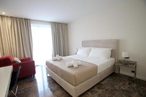 Rúm í herbergi á Durres Bay Hotel