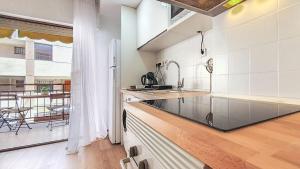 a kitchen with a sink and a counter top at Apartamento Fani Oro in Oropesa del Mar