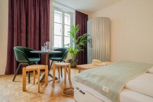 Postel nebo postele na pokoji v ubytování Marktbar Studios - Boutique Aparthotel