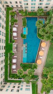 an overhead view of a swimming pool in a building at Hyatt Pune in Pune