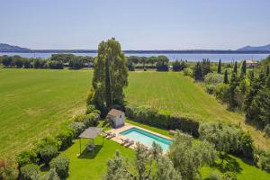 an aerial view of a large field with a house and a swimming pool at Chalet Vignarola - Happy Rentals in Orbetello