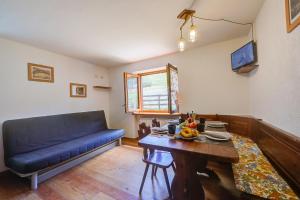 Televízia a/alebo spoločenská miestnosť v ubytovaní Miramonti 21 Ski In - Ski Out - Happy Rentals