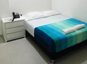Posteľ alebo postele v izbe v ubytovaní Hostal Lumar