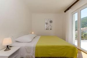 En eller flere senge i et værelse på Apartments Nedeljko