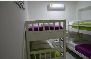 Posteľ alebo postele v izbe v ubytovaní Hostal Lumar