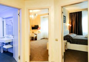 Posteľ alebo postele v izbe v ubytovaní Myo Hotel Mysterius