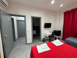 A bed or beds in a room at Affittacamere Sikelia