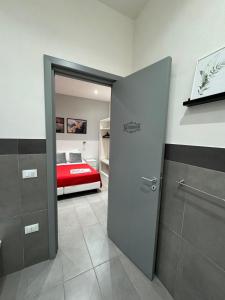 A bed or beds in a room at Affittacamere Sikelia